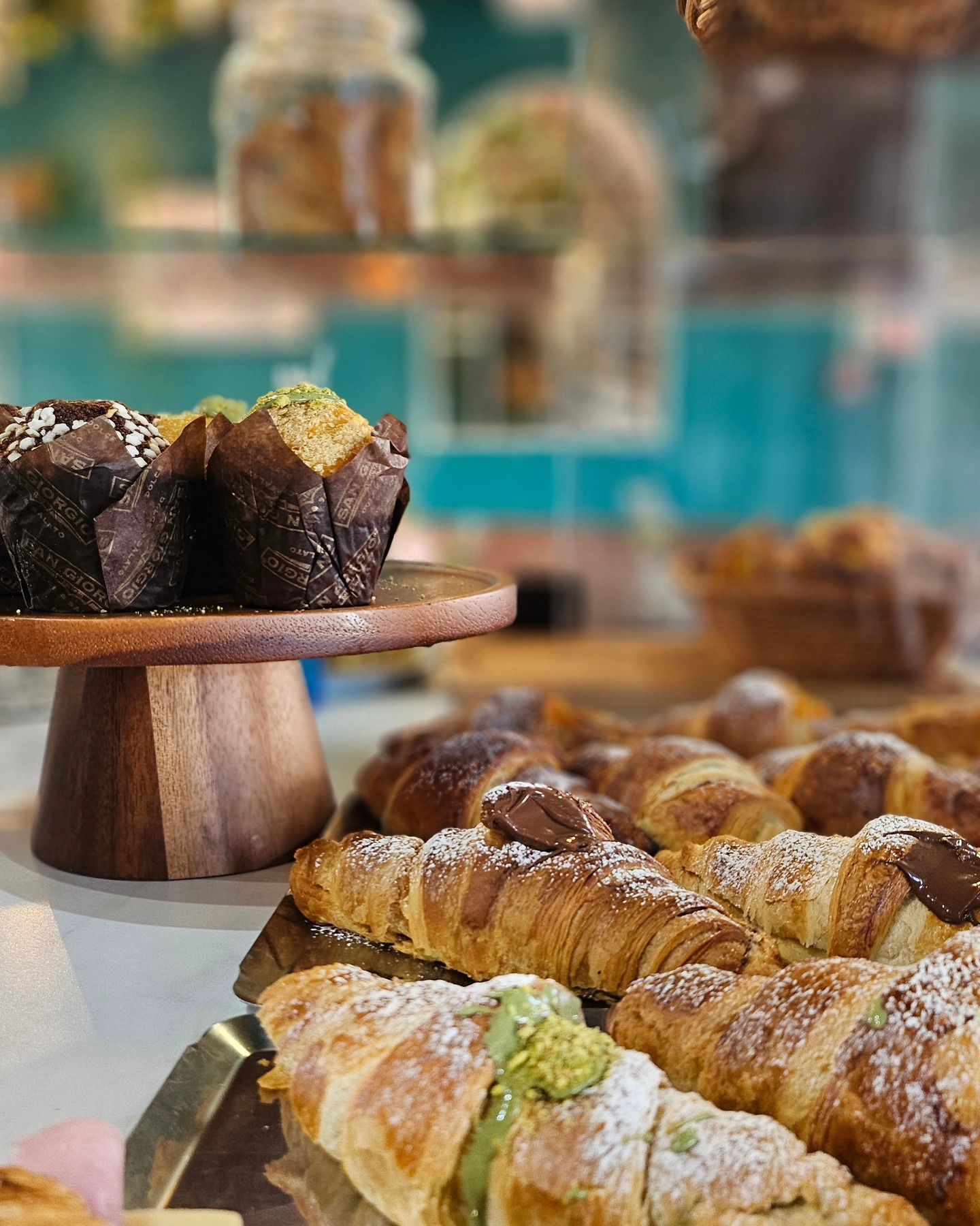 A basket of fresh pastries at the counter